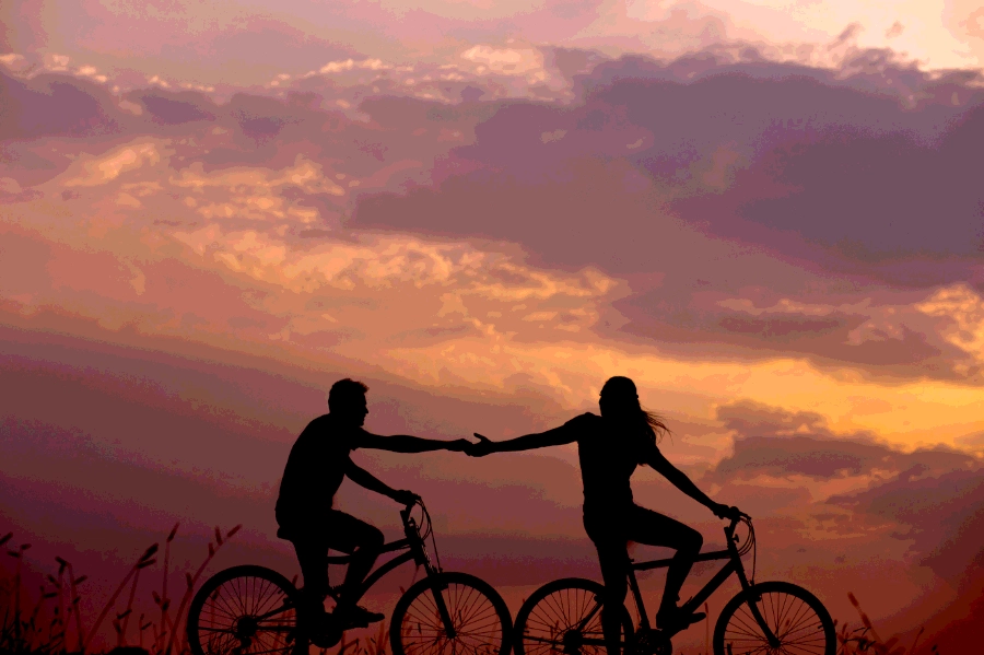 Couple riding bikes